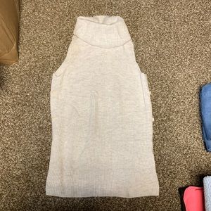 Cream turtleneck sleeveless vest